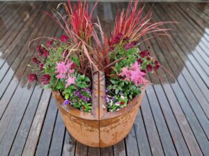 Cruach Design Garden Collection Corten Steel Iroko Hardwood Bench with curved Planters