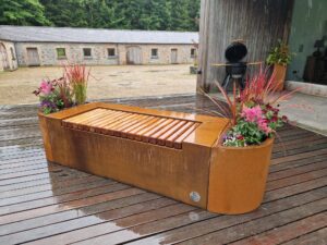 Cruach Design Garden Collection Corten Steel Iroko Hardwood Bench with curved Planters